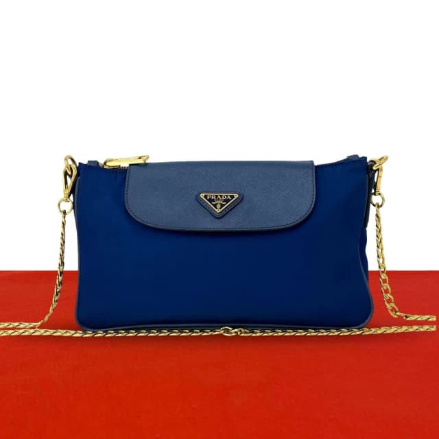 Prada Triangle Logo Tessuto Nylon Saffiano Leather Chain Shoulder Bag Pochette in Saffiano leather from The Reluxe, photo 1 of 1