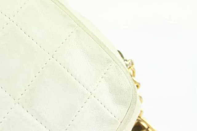 Chanel White Quilted Leather Diamond Clutch on Chain Tassel Bag in White Leather from Bagriculture, photo 1 of 1