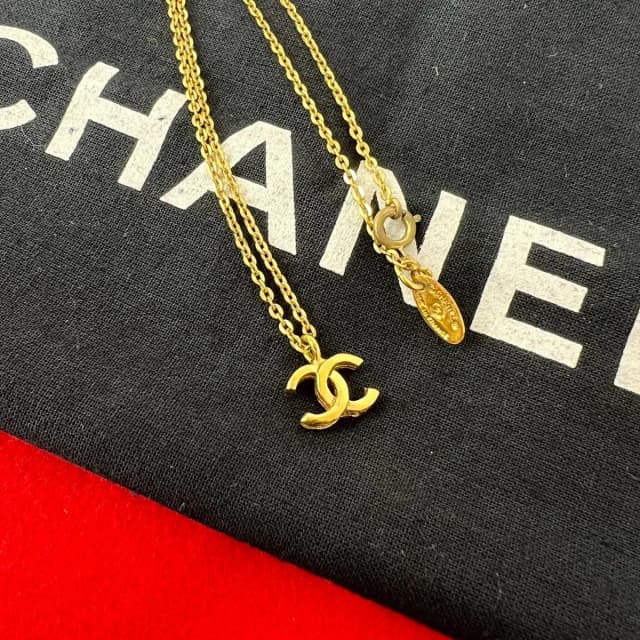Chanel Comment Vintage CC Logo Motif Pendant Gold in Gold from The Reluxe, photo 1 of 1