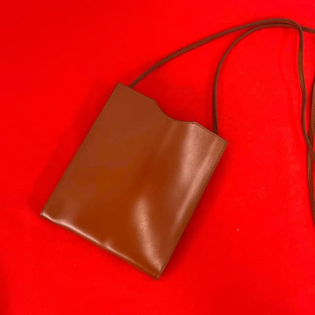 Hermès Omenitu Vintage Leather Shoulder Bag Mini Pochette Crossbody Brown in Brown Leather from The Reluxe, photo 1 of 1