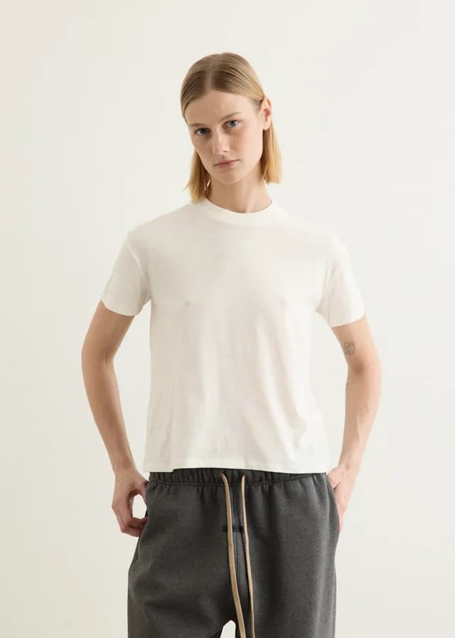 Fear of God Essentials Women's Embroidered Classic Fit T-Shirt in Ivory, image 1 of 1 from Incu