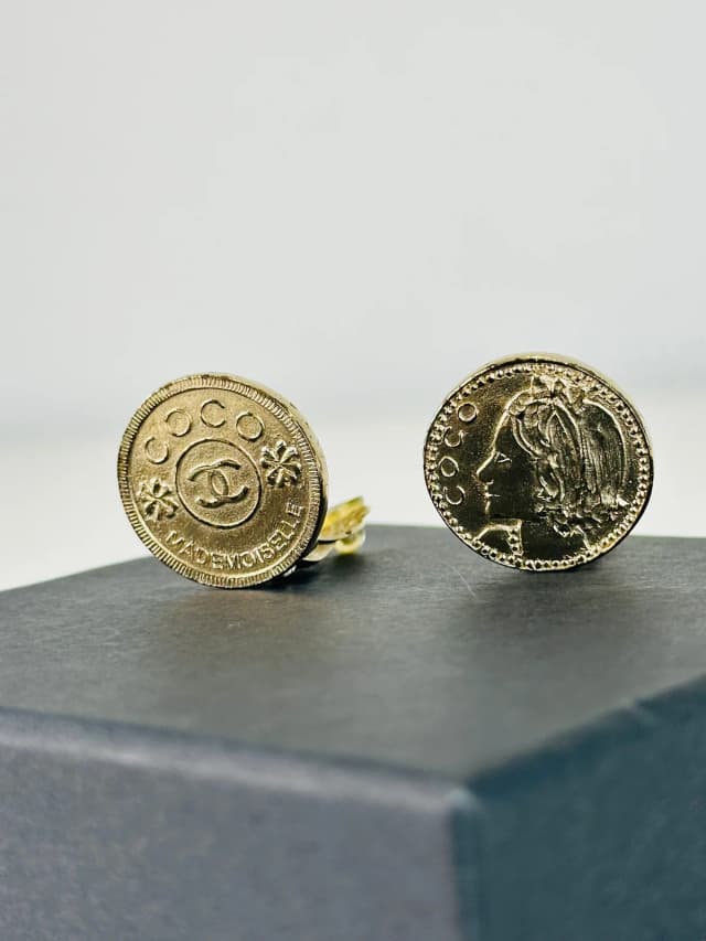 Chanel Gold Plated Mademoiselle Coin Clip-on Earrings in Gold from Edit Second Hand, photo 1 of 1