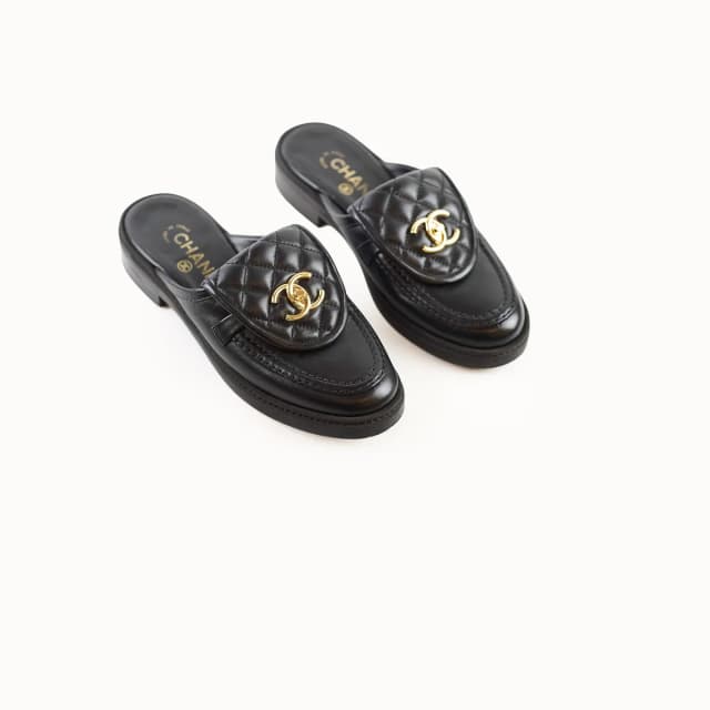 Chanel CC Turnlock Flat Mules size 36.5 in Leather from The Purse Affair, photo 1 of 1