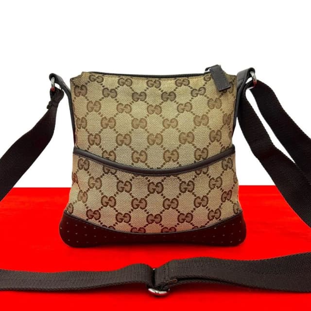 Gucci GG Logo Canvas Perforated Leather Mini Shoulder Bag Pochette Crossbody in Canvas from The Reluxe, photo 1 of 1