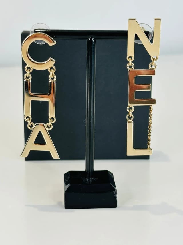 Chanel Gold Tone Letter Drop Earrings in Gold from Edit Second Hand, photo 1 of 1