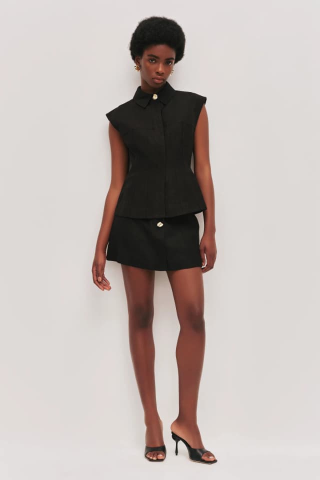 AJE Magnolia Mini Skirt in BLACK, image 1 of 1 from Aje