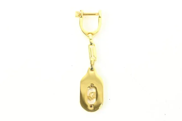 Dior Gold Bag Charm Logo Pendant Keychain in Gold from Bagriculture, photo 1 of 1