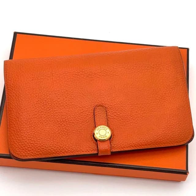 Hermès Wallet Dogon GM Taurillon Clemence Orange Gold in Orange Clemence leather from The Reluxe, photo 1 of 1