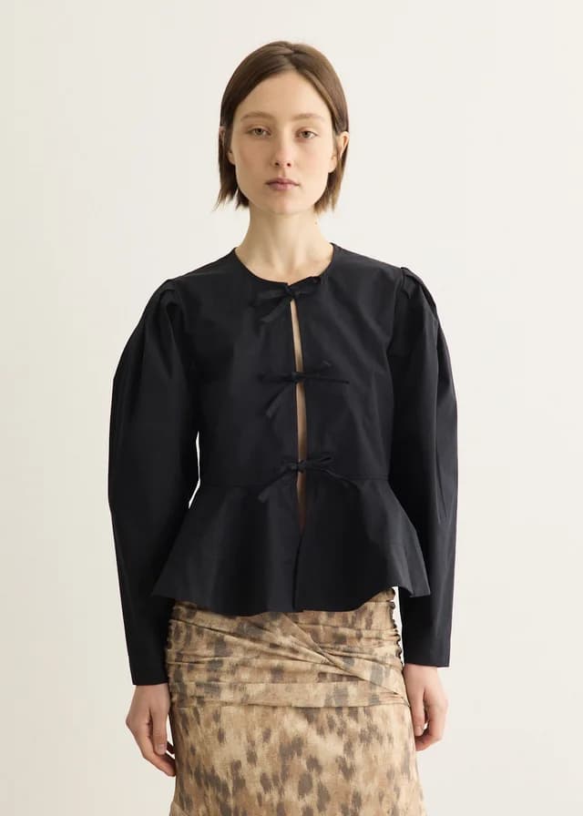 Ganni Compact Poplin Long Sleeve Peplum Blouse in Black, image 1 of 1 from Incu