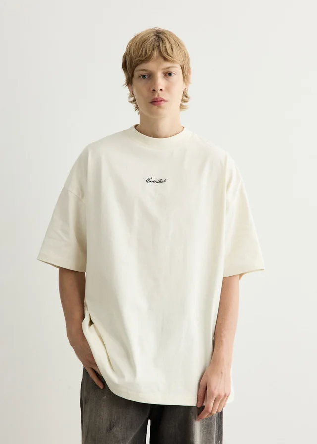 Fear of God Essentials Signature 90s Short Sleeve T-Shirt in IVORY, image 1 of 1 from Incu