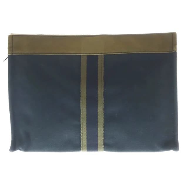 Hermès Fourre Tout Canvas Clutch Silver Khaki Navy in Navy Canvas from The Reluxe, photo 1 of 1