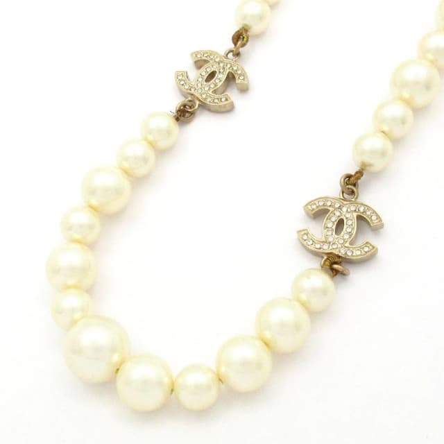 Chanel Necklace CC Logo Ivory Gold Faux Pearl Rhinestone in White from The Reluxe, photo 1 of 1