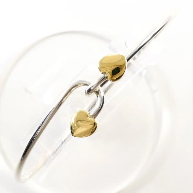 Tiffany & Co. Love Knot 18K Yellow Gold 925 Sterling Silver Bangle Bracelet in Yellow from The Reluxe, photo 1 of 1