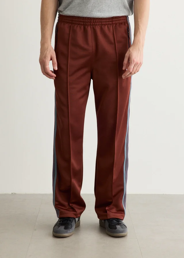Needles Poly Smooth Track Pants in A-Rust, image 1 of 1 from Incu