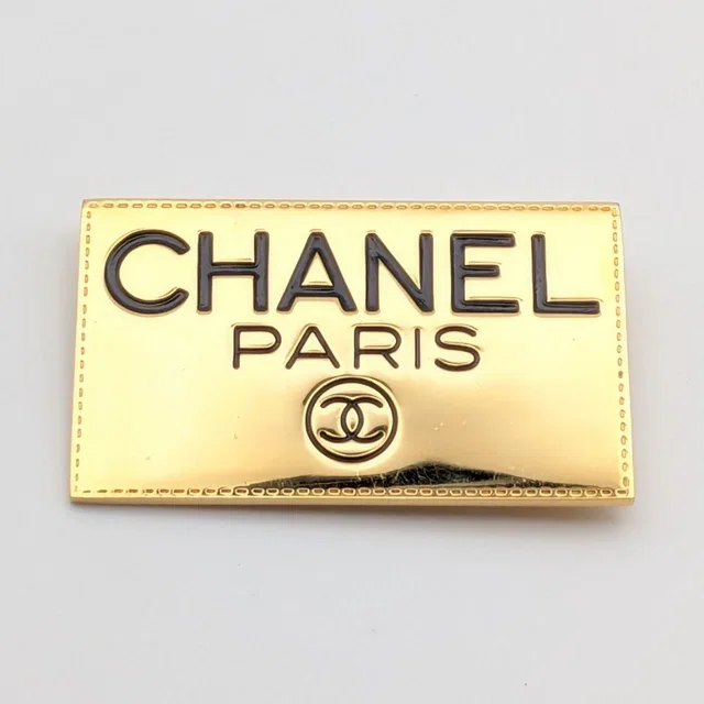Chanel Brooch CC Logo Plate Gold First Era Vintage in Gold from The Reluxe, photo 1 of 1