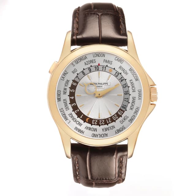 Patek Philippe Complications (Reference 5130J). A 39.5mm yellow gold automatic wristwatch with world time and… in Yellow Crocodile from Sotheby's, photo 1 of 1