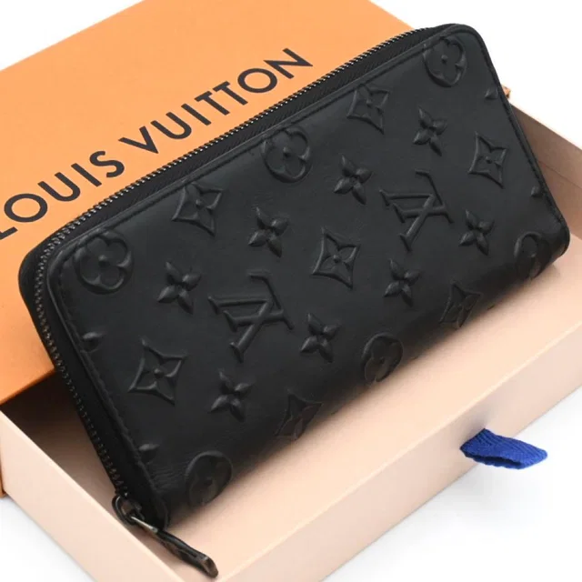Louis Vuitton Monogram Seal Zippy Wallet Vertical Black in Black Leather from The Reluxe, photo 1 of 1