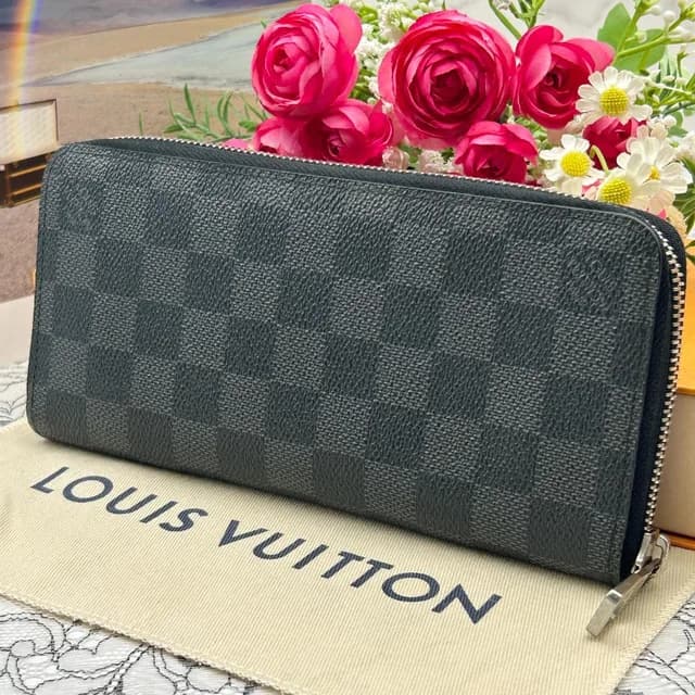 Louis Vuitton Damier Graphite Vertical Zippy Wallet in Grey from The Reluxe, photo 1 of 1