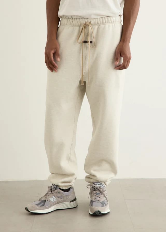 Fear of God Essentials Classic Sweatpants in Oatmeal Heather, image 1 of 1 from Incu