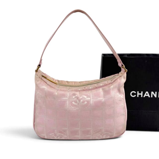 Chanel New Travel Line Hand Pink Mini Handbag Pouch Nylon Canvas CC Logo in Pink Canvas from The Reluxe, photo 1 of 1