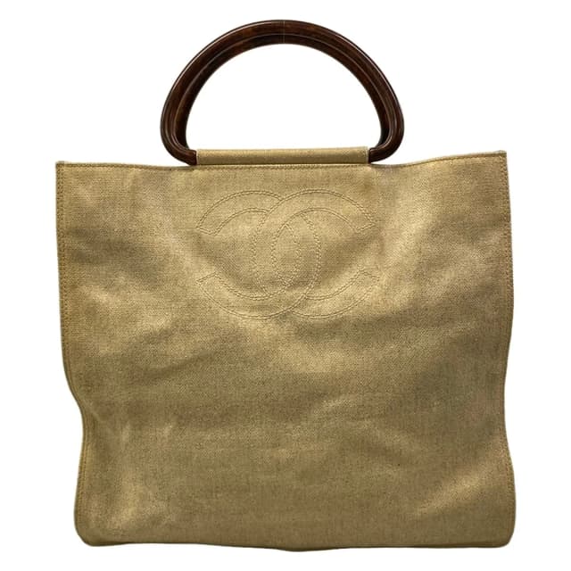 Chanel Tote Bag Ivory CC Logo Gold Wood Look Handle Lambskin in White Lambskin from The Reluxe, photo 1 of 1