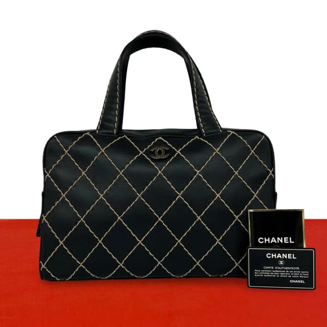 Chanel CC Logo Wild Stitch Leather Mini Boston Bag Black in Black Leather from The Reluxe, photo 1 of 1