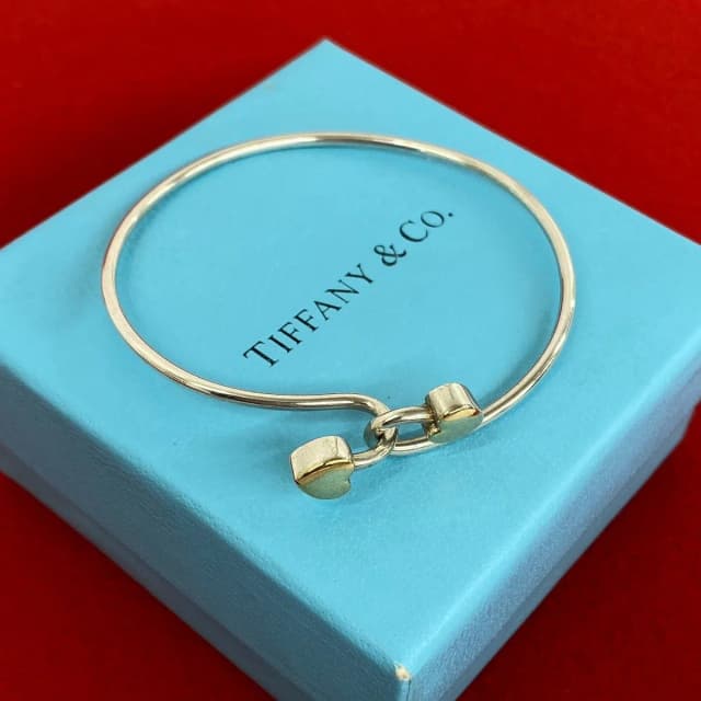 Tiffany & Co. Vintage Solid Double Heart Hook Bangle Silver Gold Bracelet in Gold from The Reluxe, photo 1 of 1