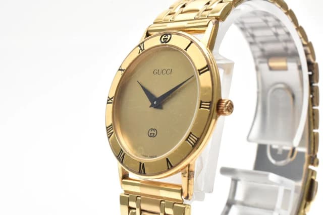 Gucci Quartz Watch Gold Dial 2 Hand Roman Numeral Bezel Plate Stainless Steel in Gold from The Reluxe, photo 1 of 1