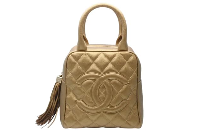 Chanel Handbag Caviar Leather CC Logo Fringe Gold in Gold Caviar leather from The Reluxe, photo 1 of 1