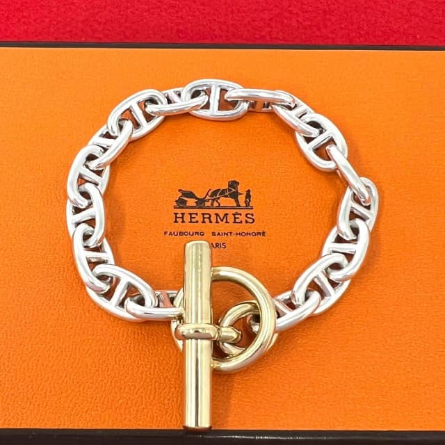 Hermès Vintage Patine MM 17 Links Bracelet Cursive Logo Silver Gold in Gold from The Reluxe, photo 1 of 1