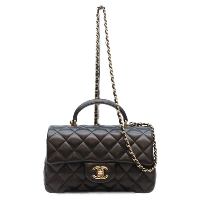 Chanel Top Handle Mini Quilted 20 in Black Lambskin from The Reluxe, photo 1 of 1