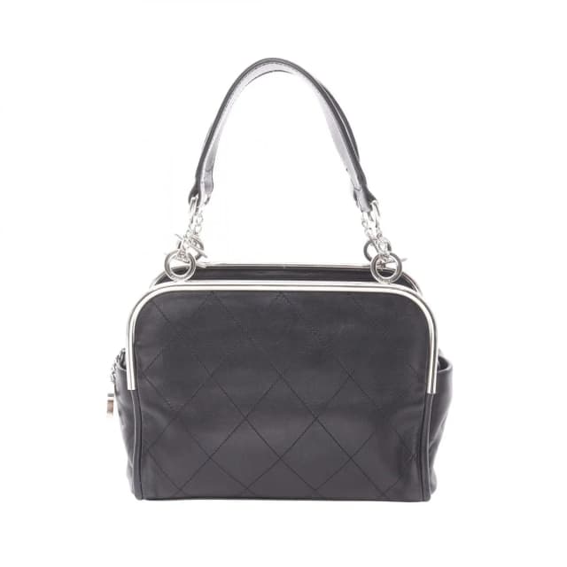 Chanel Handbag Quilted Black Lambskin Coco Charm in Black Lambskin from The Reluxe, photo 1 of 1