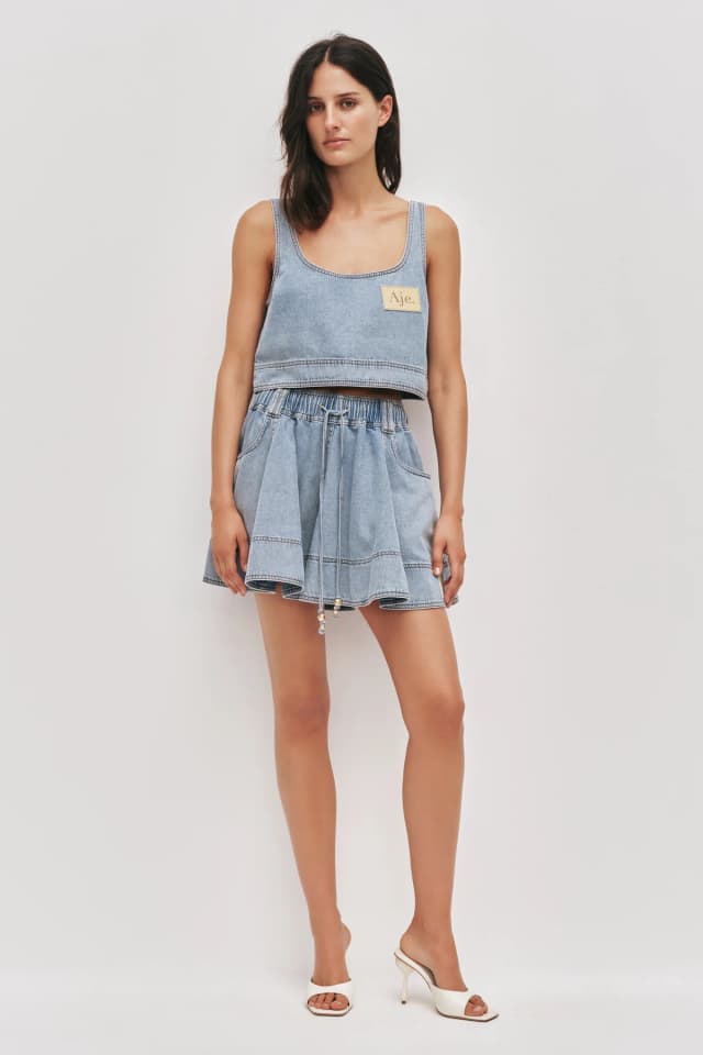 AJE Lumi Denim Top in SEA SPRAY WASH, image 1 of 1 from Aje
