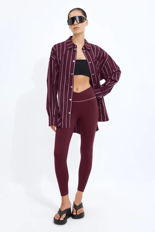 Athletica Full Length Cross Front Legging in BURGUNDY, image 1 of 1 from Aje