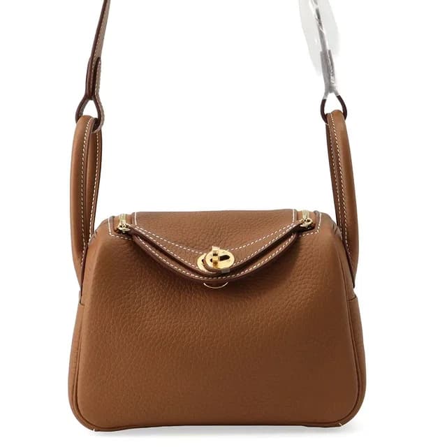 Hermès Handbag Lindy Mini Gold Taurillon Clemence 2-Way in Gold Clemence leather from The Reluxe, photo 1 of 1