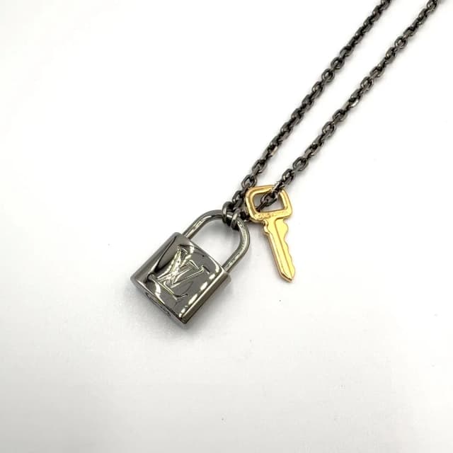 Louis Vuitton Padlock Metal Yellow Gold Black Necklace in Black from The Reluxe, photo 1 of 1