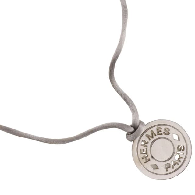 Hermès Sellier Medallion Silk Code Bijouterie Fantaisie Metal Gray Necklace in Grey Silk from The Reluxe, photo 1 of 1