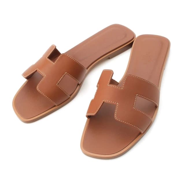 Hermès Oran Leather Sandals Gold in Gold Leather from The Reluxe, photo 1 of 1