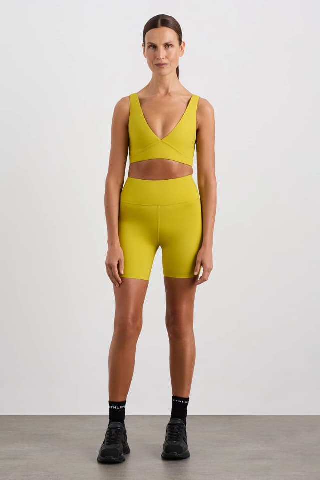 Athletica Perforated Hem Mid Length Short 601 in SOLAR BLAZE, image 1 of 1 from Aje