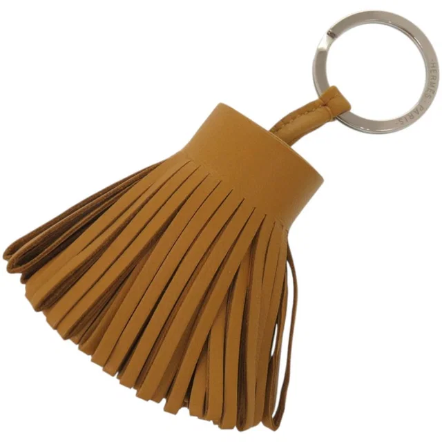 Hermès Bag Charm Fringe Key Holder Agneau Milo Sesame Brown Carmen in Brown from The Reluxe, photo 1 of 1