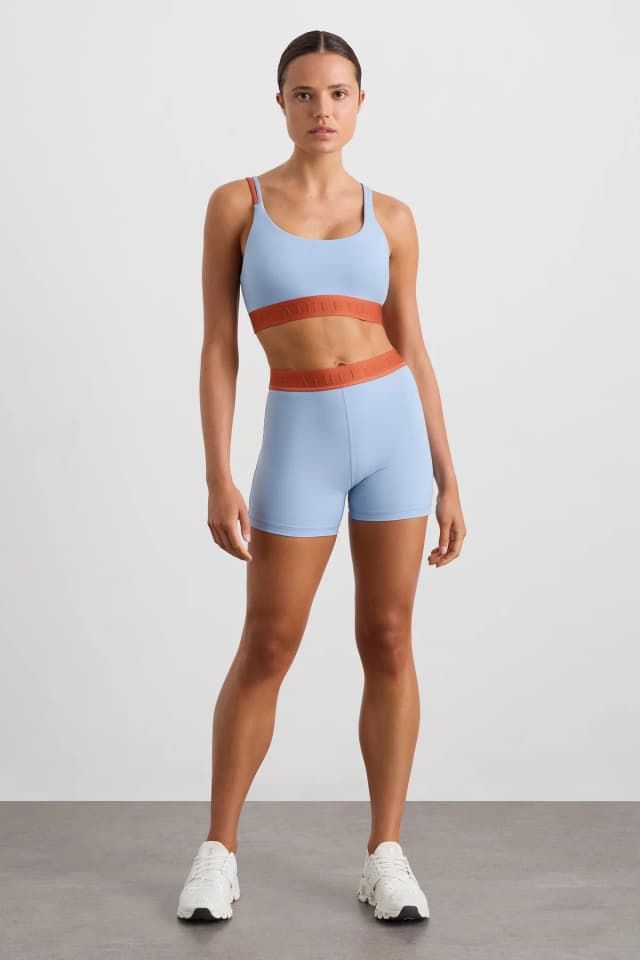 Athletica Bike Short 017 in STEEL BLUE COPPER ORANGE, image 1 of 1 from Aje