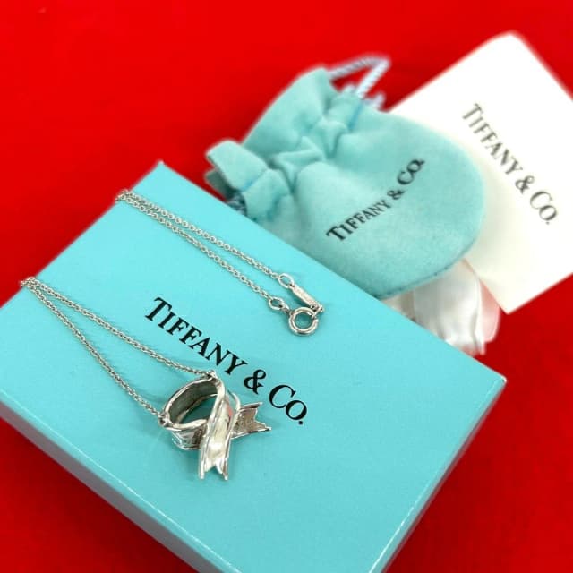 Tiffany & Co. Box Vintage Cross Ribbon Necklace 925 Sterling Silver Pendant in Silver from The Reluxe, photo 1 of 1