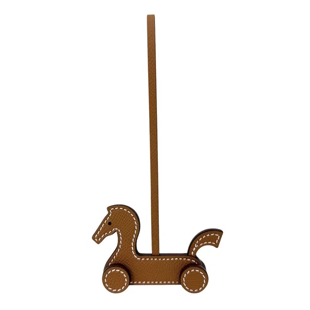 Hermès Key Holder Cheval Aroulette Charm Bag Leather Brown in Brown Leather from The Reluxe, photo 1 of 1