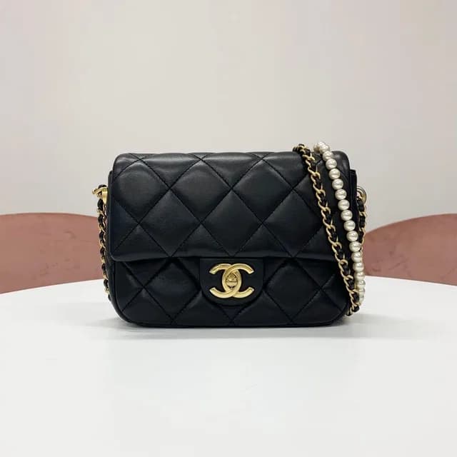 Chanel Mini Quilted CC Logo Lambskin Turnlock Shoulder Bag in Lambskin from The Reluxe, photo 1 of 1
