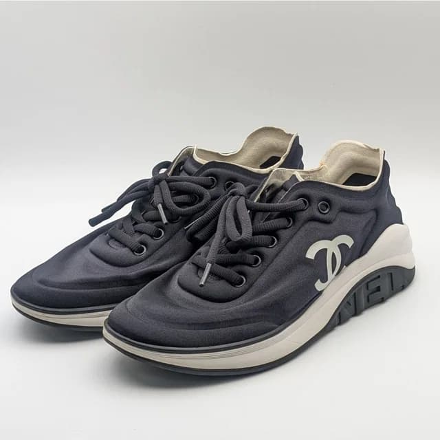 Chanel Sneakers CC Logo Black White Fabric Shoes in Black from The Reluxe, photo 1 of 1