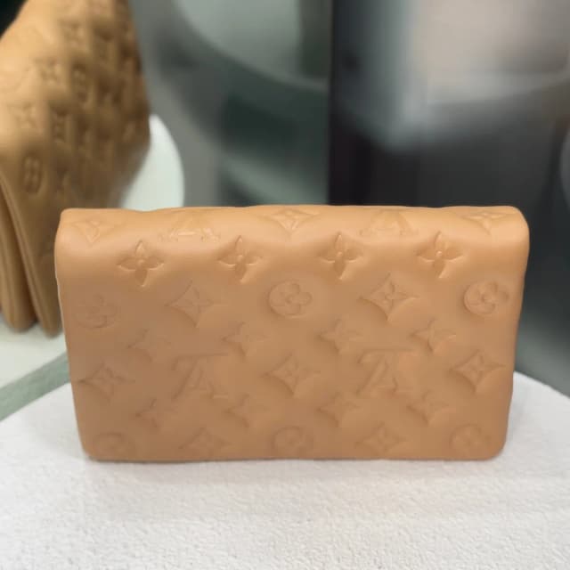 Louis Vuitton Pochette Coussin Clutch - Camel in Brown Lambskin from Revivre Luxury Consignment, photo 1 of 1