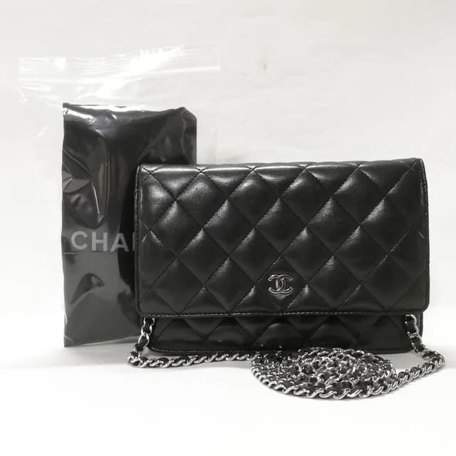 Chanel Lambskin Chain Wallet CC Logo Black Shoulder Bag in Black Lambskin from The Reluxe, photo 1 of 1