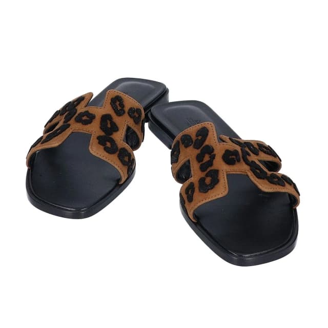 Hermès Leopard Blanc Fume Oran Leather Sandals in White Leather from The Reluxe, photo 1 of 1