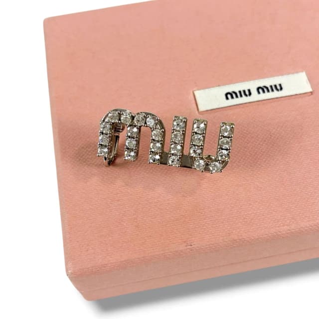 Miu Miu Crystal Logo Pierced Earrings Asymmetric Design Worn by Wonyoung from The Reluxe, photo 1 of 1