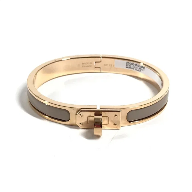 Hermès Bracelet Mini Clic Kelly PM Mini Metal Brown Glace Beige in Brown from The Reluxe, photo 1 of 1